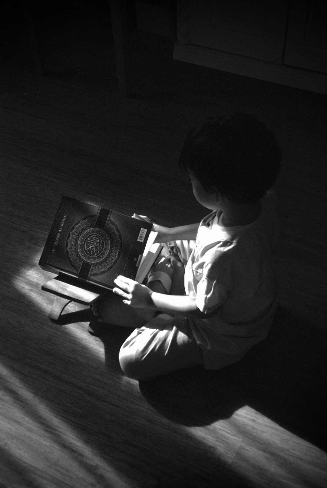 🕰️ The Toddler Tech Tangle: A Brief History of Tablets for Tiny Hands by Best Kids Tablets boy in white long sleeve shirt playing with a black and white camera